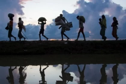 Foto de migrantes climáticos em fuga deixando os seus lares.
